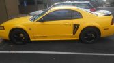 4th gen yellow 1999 Ford Mustang V6 salvage title For Sale