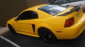 4th gen yellow 1999 Ford Mustang V6 salvage title For Sale